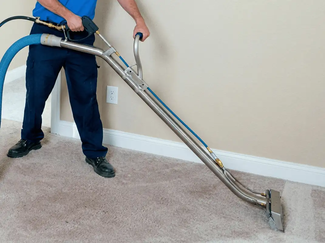 Professional operating a liquid removal machine on a carpeted floor in Las Vegas, NV